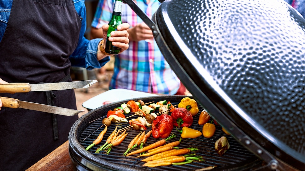 Fresh vegetables grilling on barbecue for social gathering